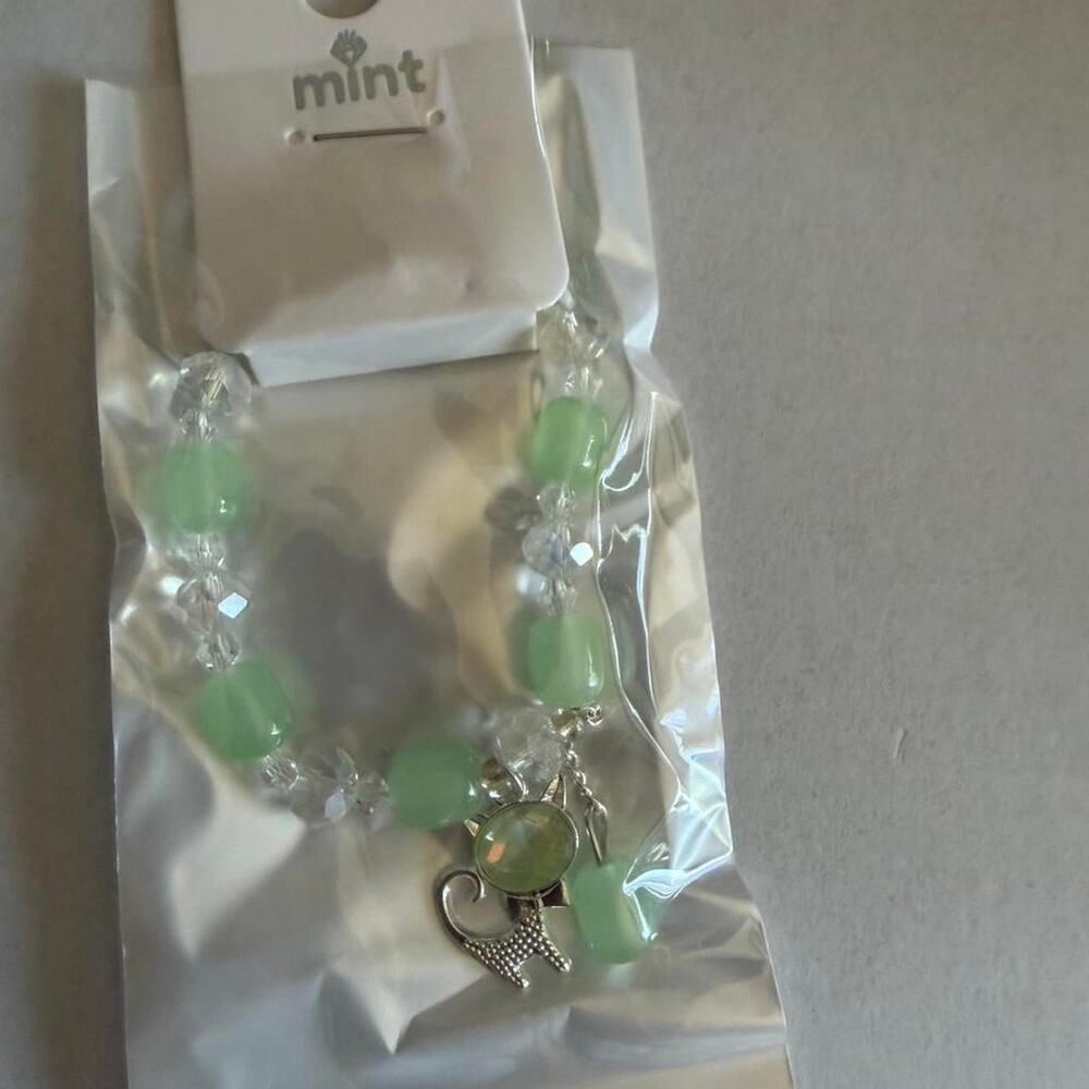 Green and white beaded bracelet